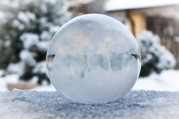 completely frozen soap bubble in winter