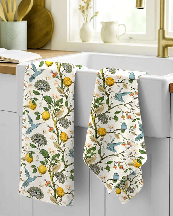 lemon & birds design on flour sack towel hanging on farmer's sink