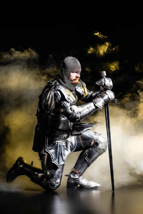 medievel knight bowing to renew his vows on New Year