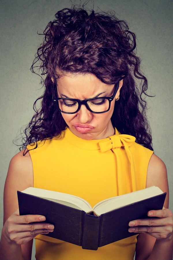 woman checking dictionary for meaning of gratitude