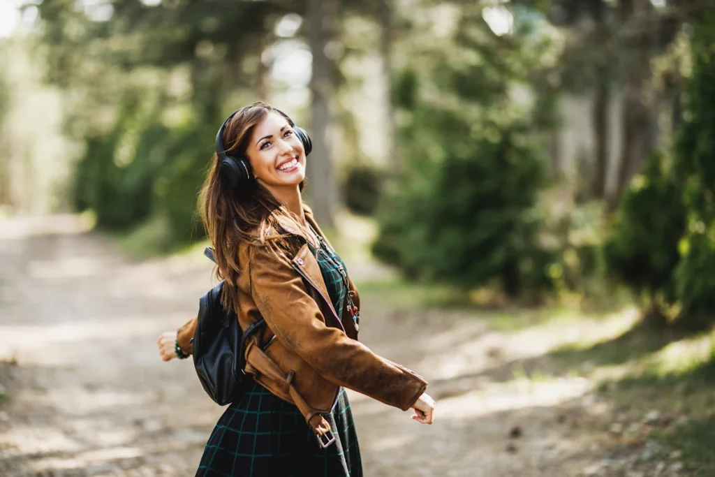 woman listening to audiobook while walking to school to start a reading habit